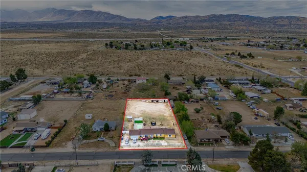 an aerial view of residential house with outdoor space
