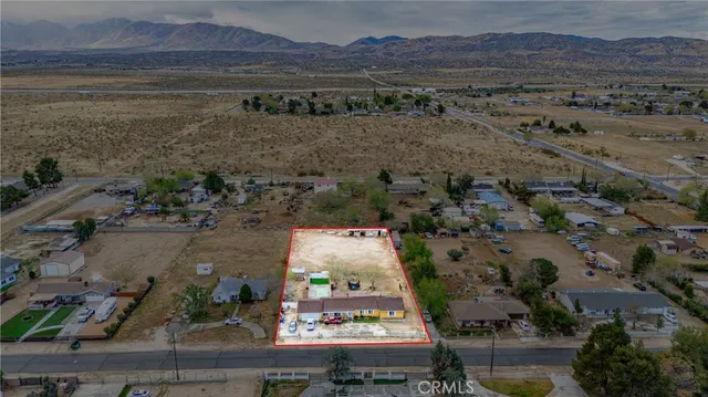 an aerial view of residential house with outdoor space