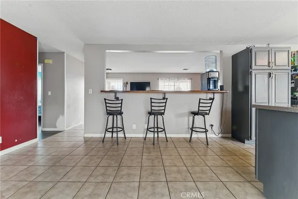 a kitchen with stainless steel appliances a refrigerator and microwave