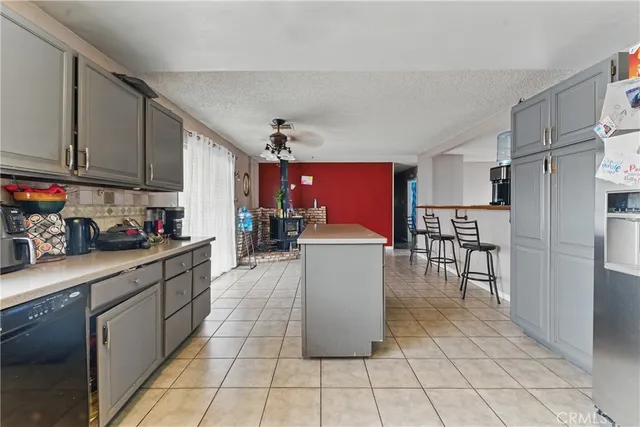 a kitchen with refrigerator cabinets and a counter top space