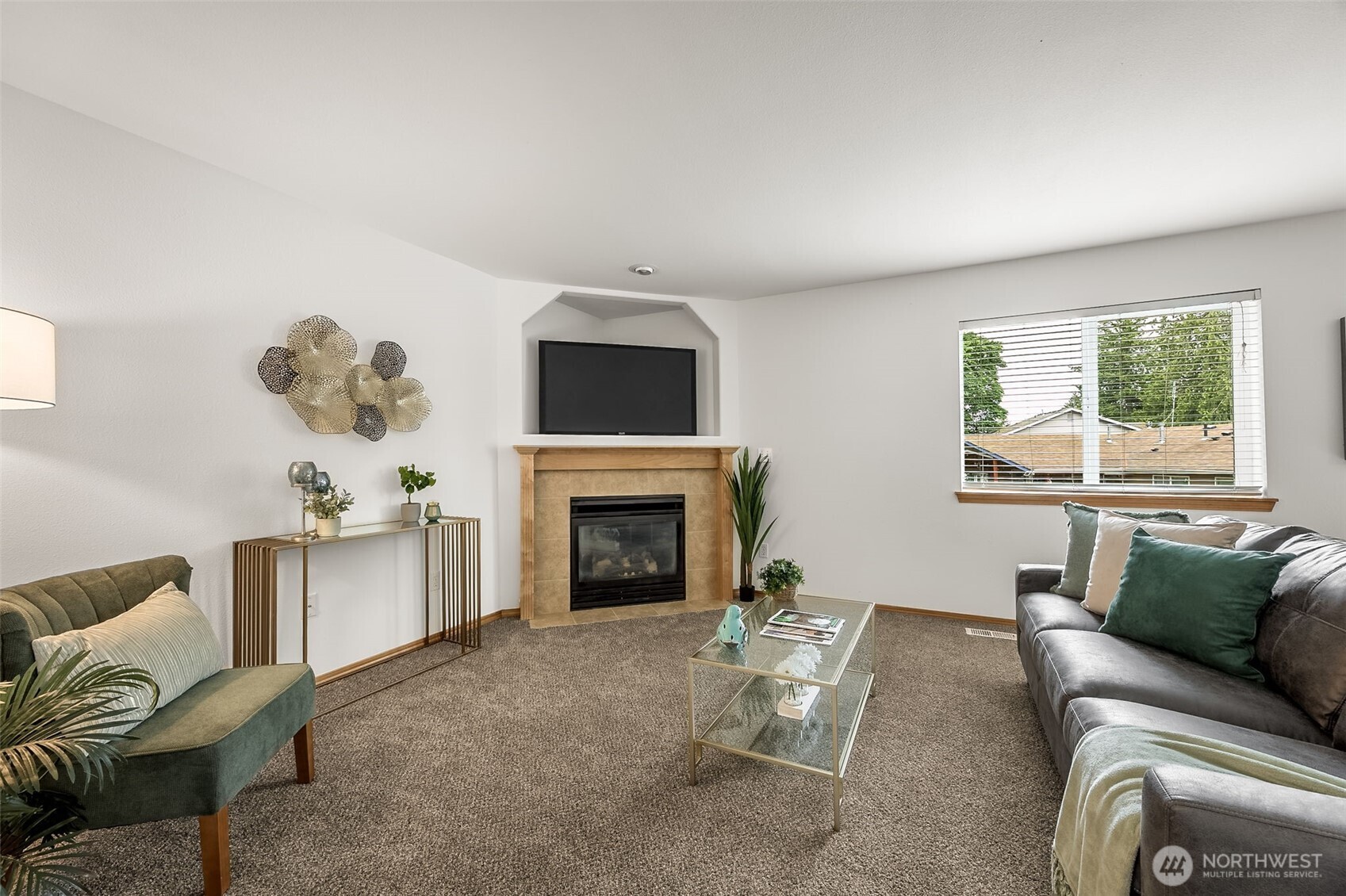 6712 Southeast 5th Street Renton, WA 98059 - Photo 13 of 30 a living room with furniture a window and a fireplace
