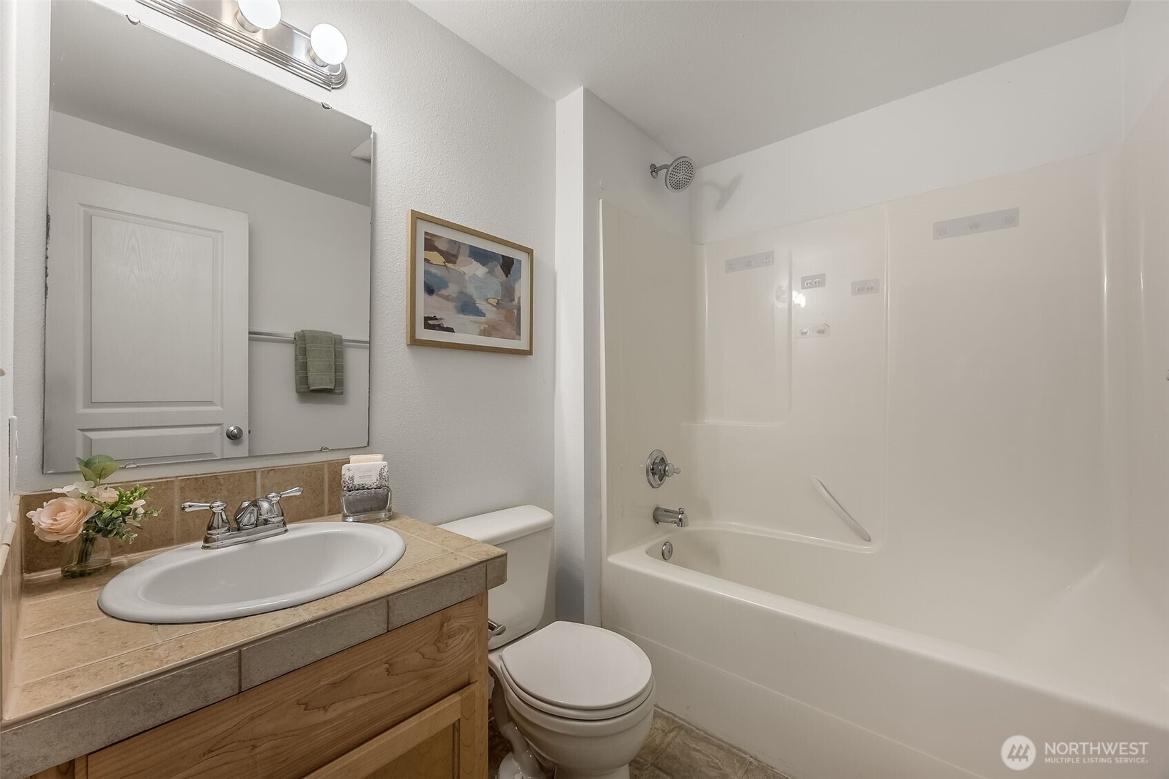 6712 Southeast 5th Street Renton, WA 98059 - Photo 20 of 30 a bathroom with a sink a toilet and a bathtub