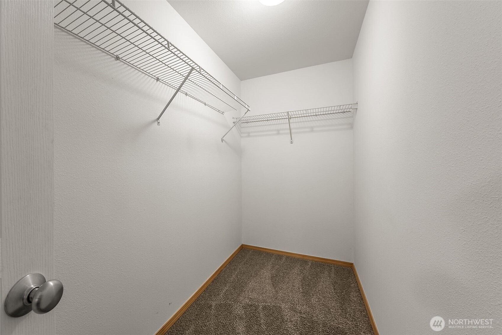 6712 Southeast 5th Street Renton, WA 98059 - Photo 23 of 30 a view of a room with racks on the wall