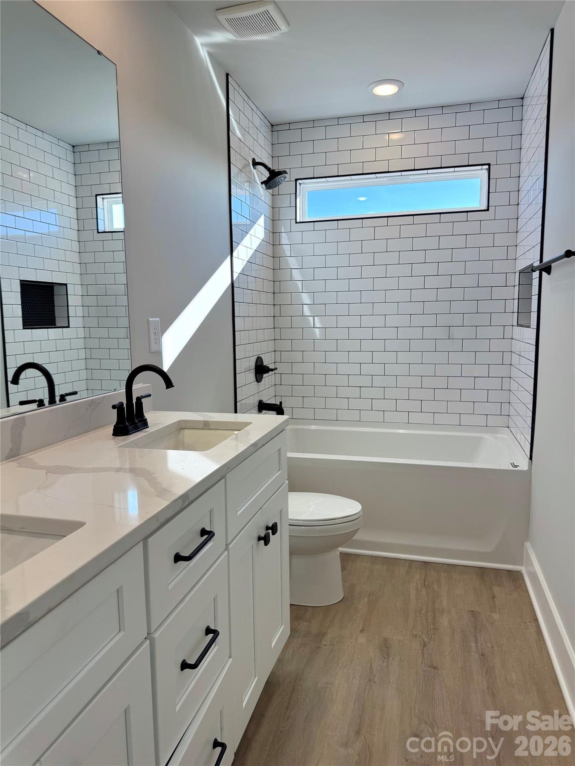 2440 Sandy Springs Road Mocksville, NC 27028 - Photo 13 of 15 a bathroom with a sink a toilet and shower
