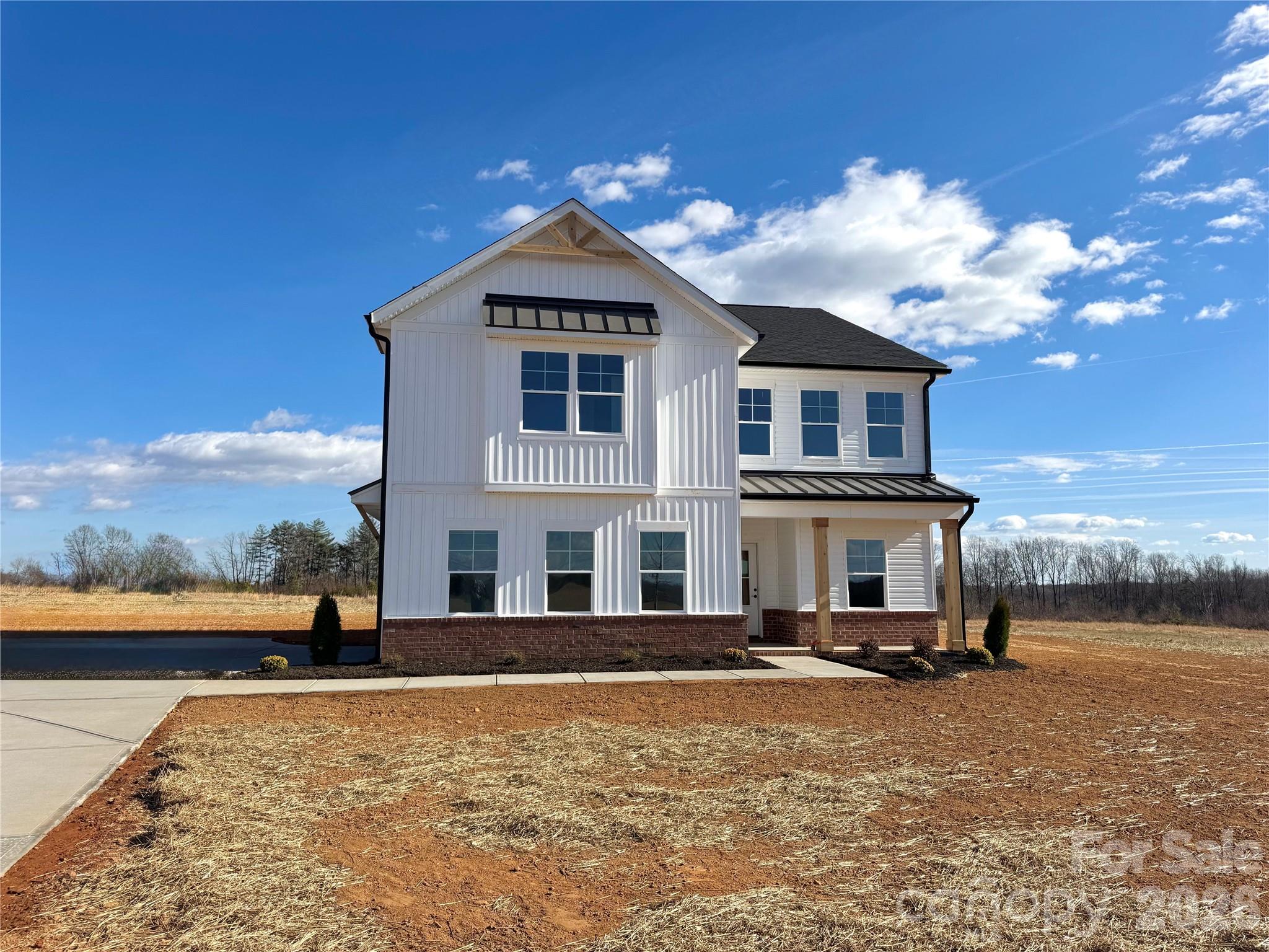 2440 Sandy Springs Road Mocksville, NC 27028 - Photo 14 of 15 a front view of a house with a yard