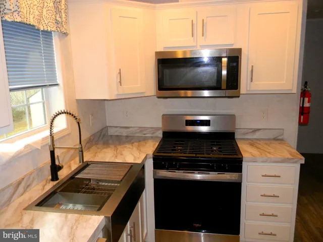 a kitchen with a stove and a microwave