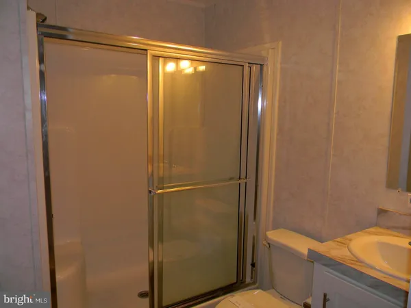 a bathroom with a shower and a toilet