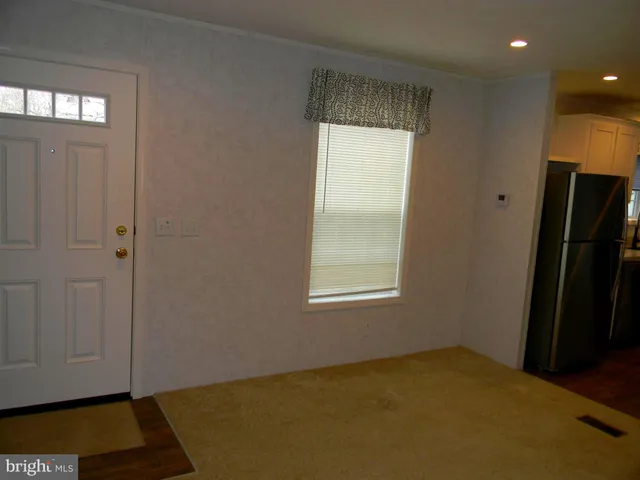 a view of an empty room and window