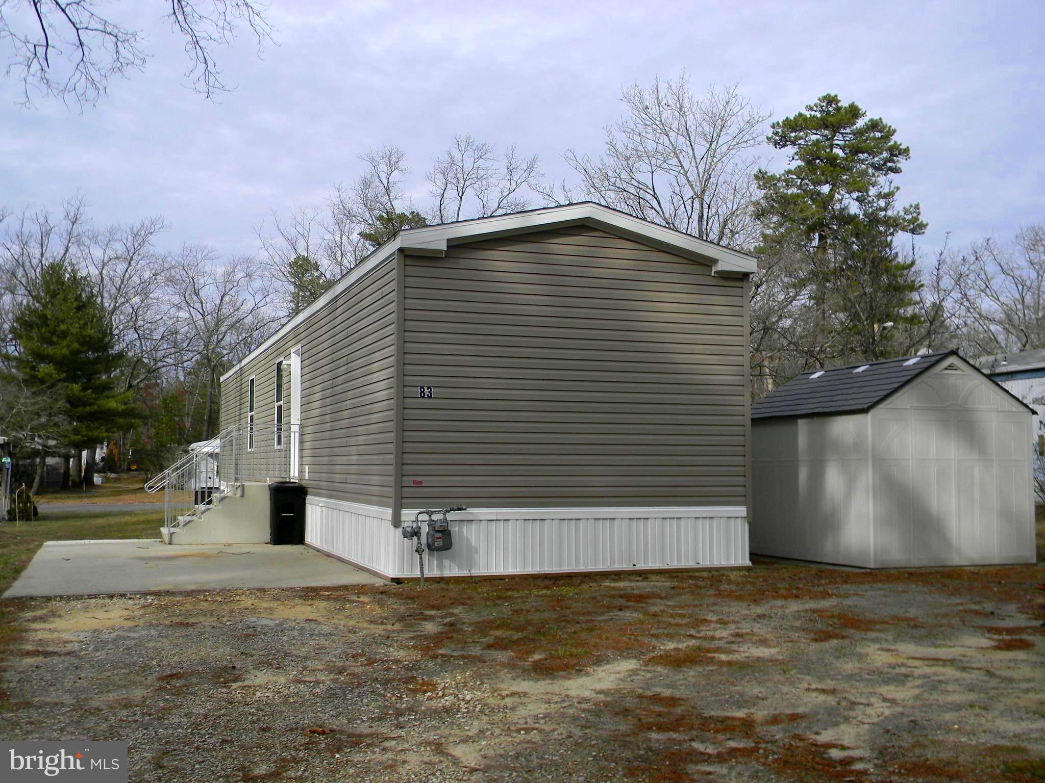 83 Holly Court Tabernacle, NJ 08088 - Photo 35 of 44 a front view of a house with a yard and garage