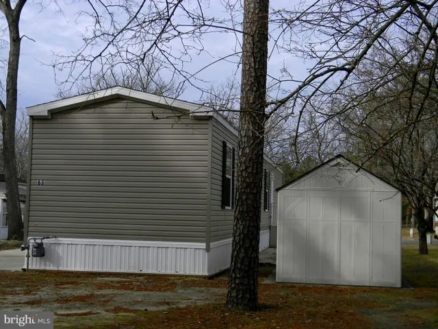 a backyard of a house with lots of trees