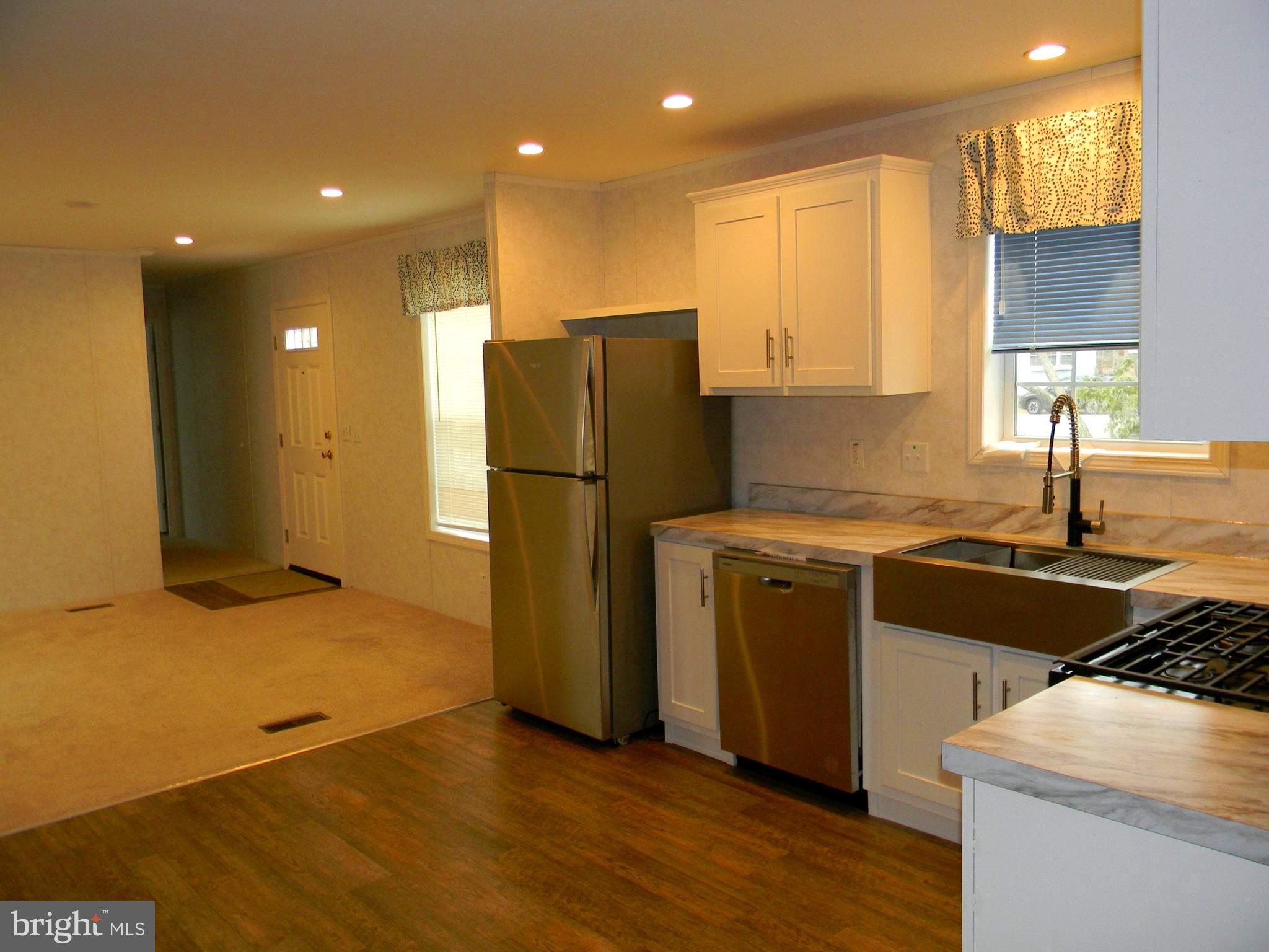83 Holly Court Tabernacle, NJ 08088 - Photo 9 of 44 a kitchen with a refrigerator and a sink