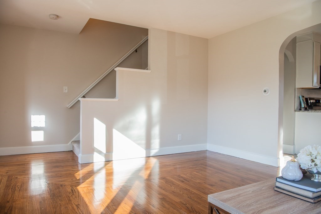 599 Granby Road Chicopee, MA 01013 - Photo 21 of 41 a view of a livingroom with wooden floor and stairs