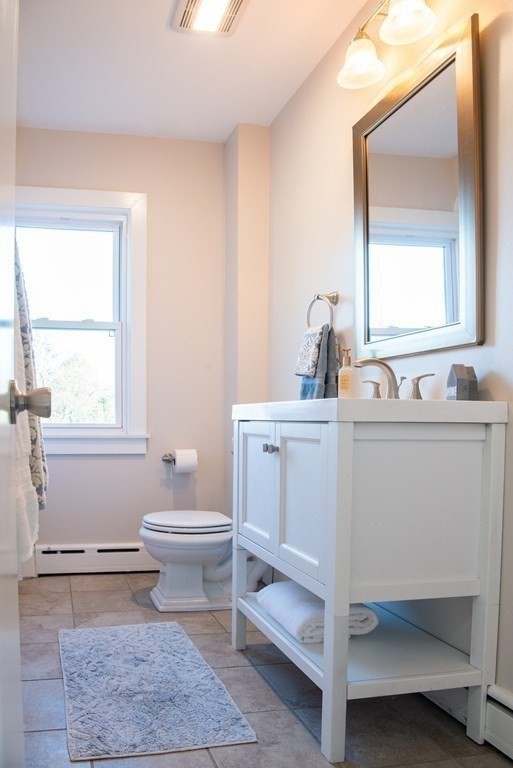 599 Granby Road Chicopee, MA 01013 - Photo 23 of 41 a bathroom with a sink a toilet and a window