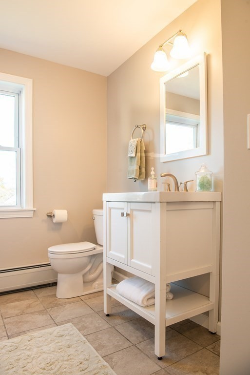 599 Granby Road Chicopee, MA 01013 - Photo 32 of 41 a bathroom with a sink toilet and mirror