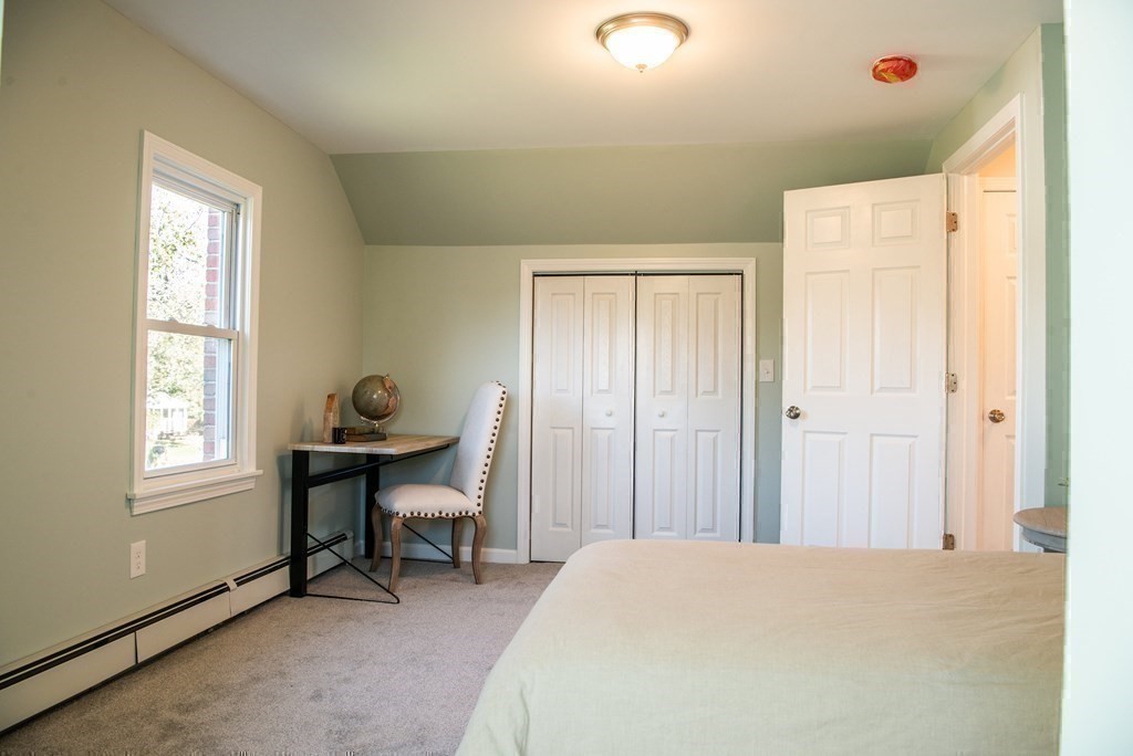 599 Granby Road Chicopee, MA 01013 - Photo 34 of 41 a bedroom with a bed and a window