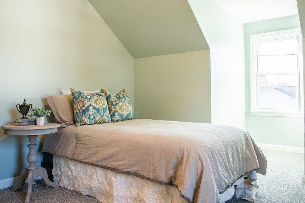 599 Granby Road Chicopee, MA 01013 - Photo 35 of 41 a bedroom with a bed and windows