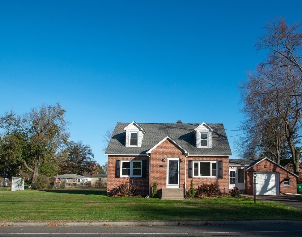 599 Granby Road Chicopee, MA 01013 - Photo 4 of 41 a front view of a house with a garden