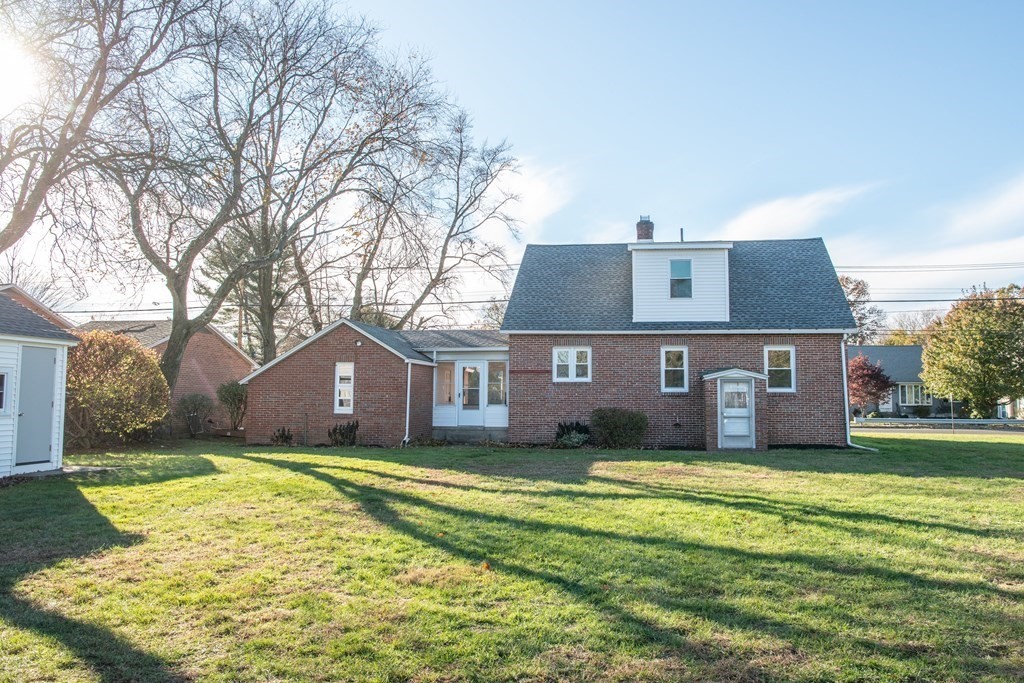 599 Granby Road Chicopee, MA 01013 - Photo 41 of 41 a front view of a house with yard and green space