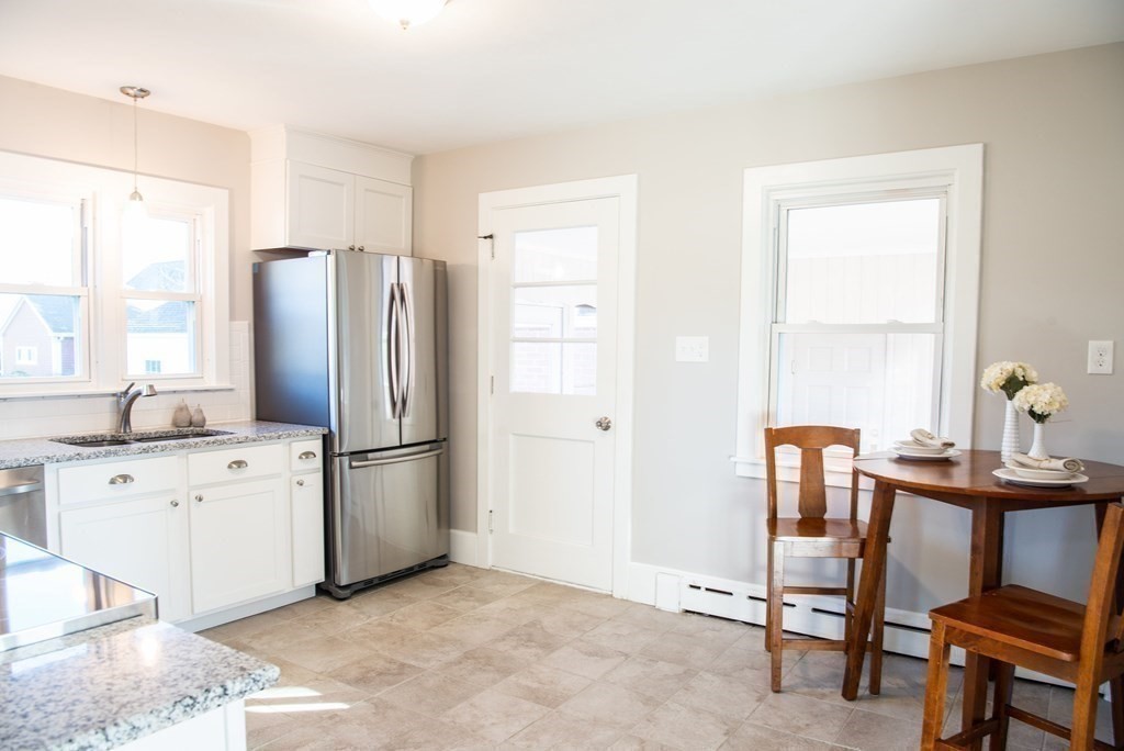 599 Granby Road Chicopee, MA 01013 - Photo 10 of 41 a kitchen with stainless steel appliances a refrigerator sink and white cabinets