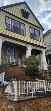 a view of kitchen with cabinets
