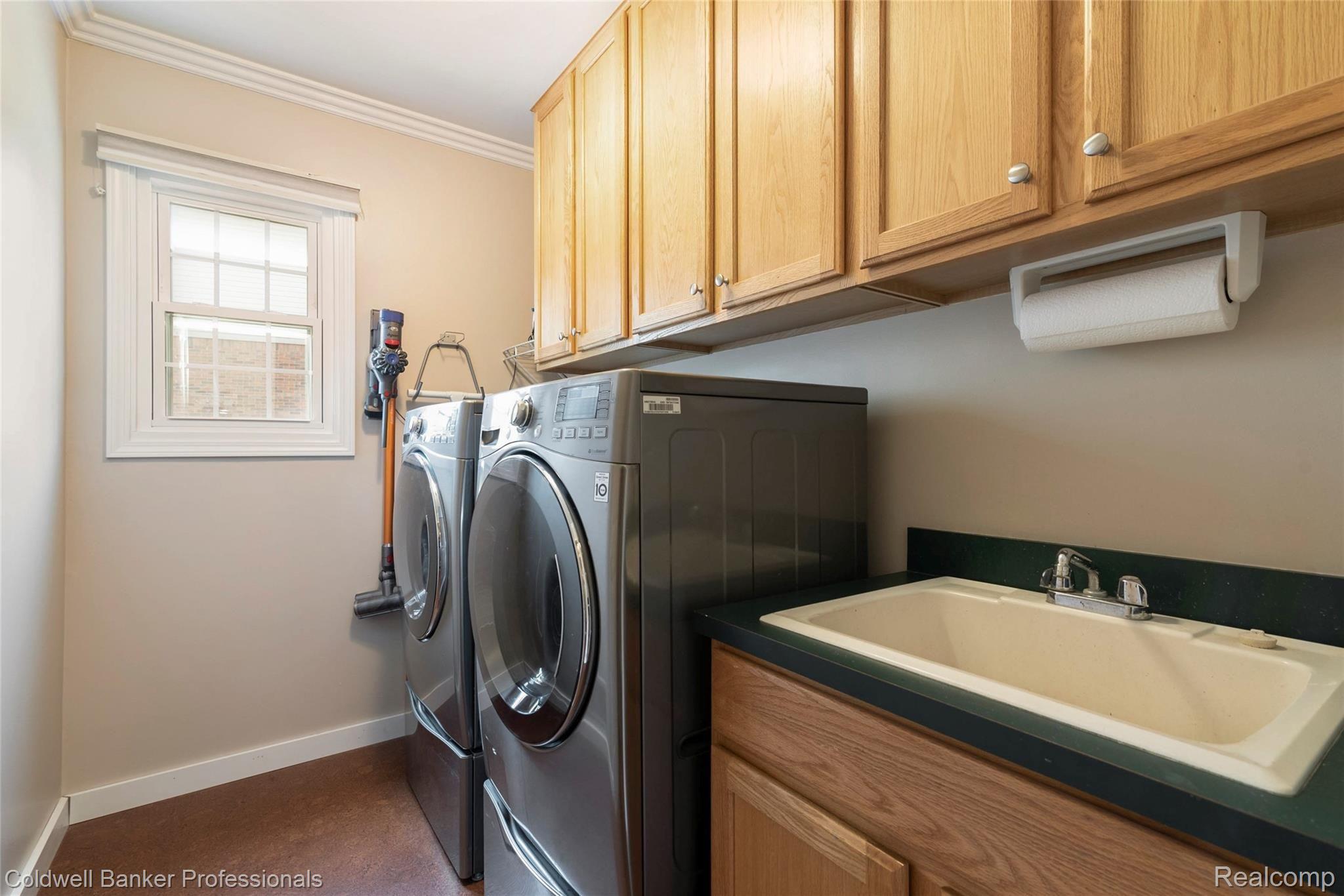 1040 Indianpipe Road Lake Orion, MI 48360 - Photo 32 of 41 1st Floor Laundry/Mud Room with Cork Floors and Lots of Storage