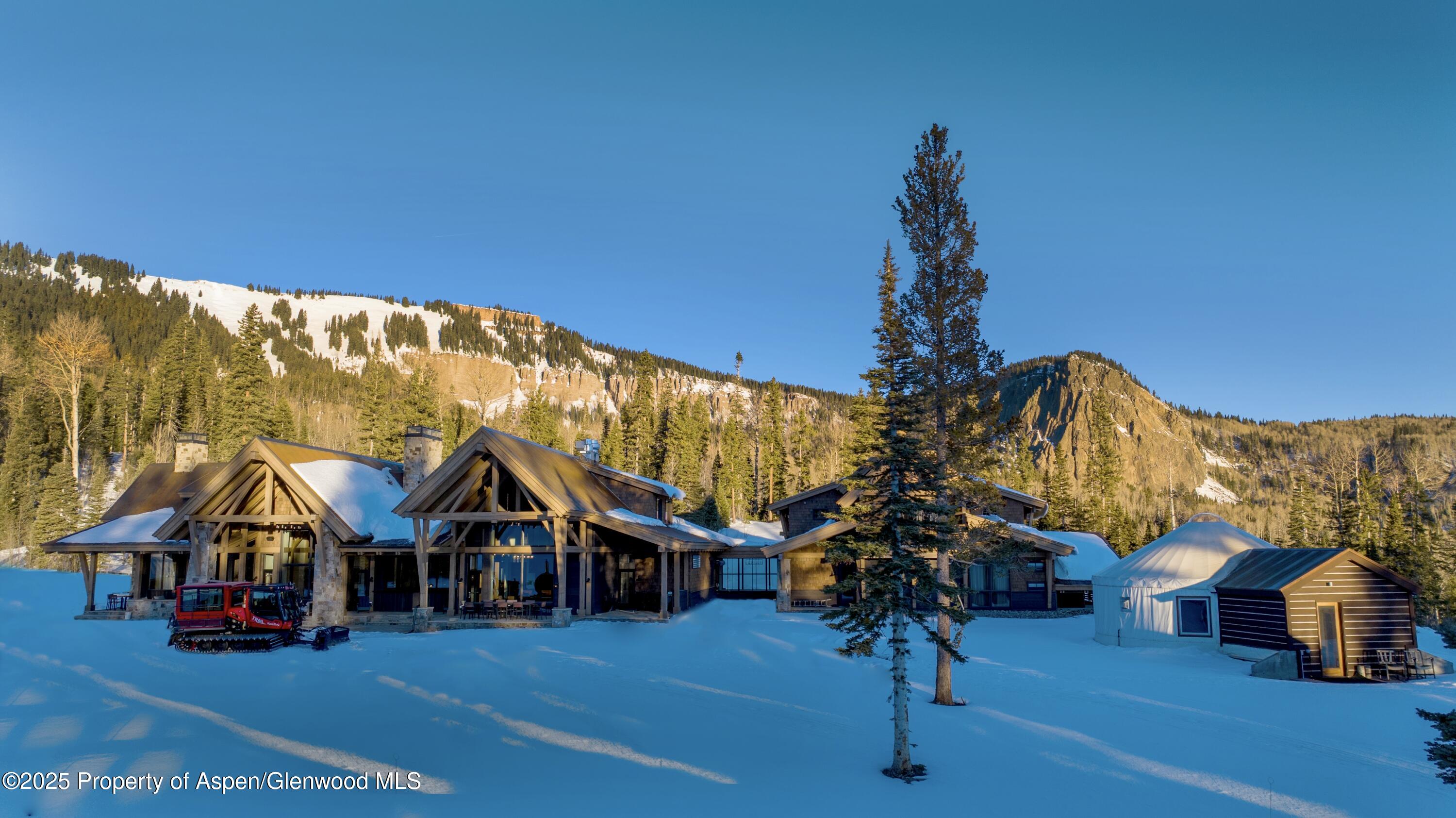 4901 Cimarron Mountain Road Montrose, CO 81403 - Photo 24 of 39 a view of a house with swimming pool and porch