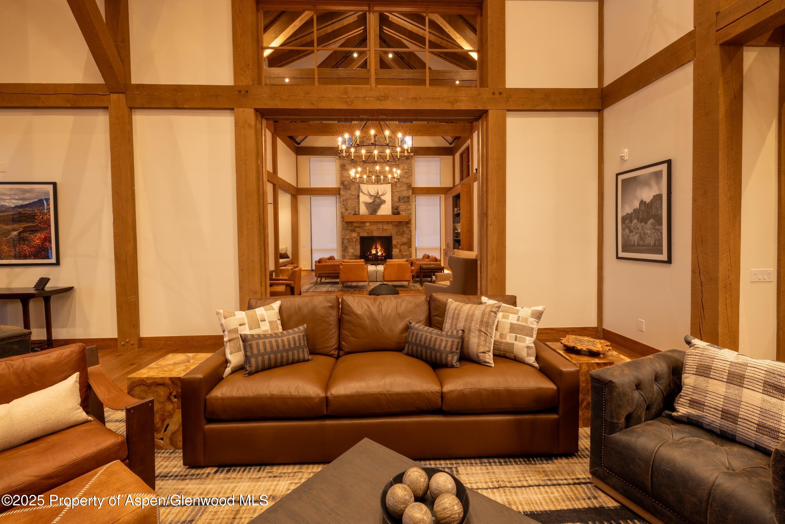 4901 Cimarron Mountain Road Montrose, CO 81403 - Photo 26 of 39 a living room with furniture and a window