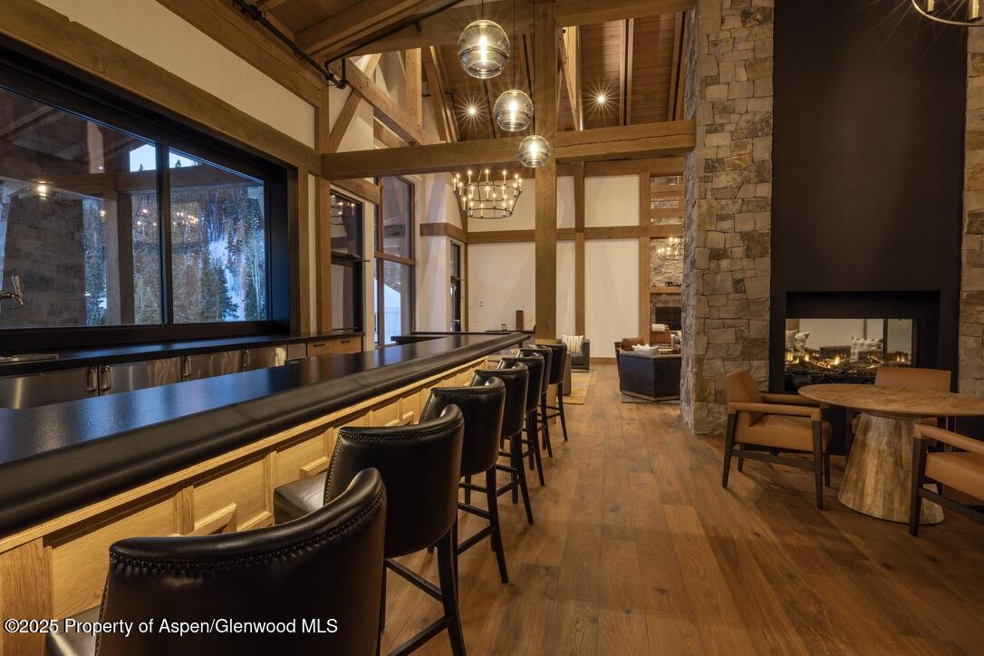 4901 Cimarron Mountain Road Montrose, CO 81403 - Photo 28 of 39 a view of a dining room with furniture window and wooden floor