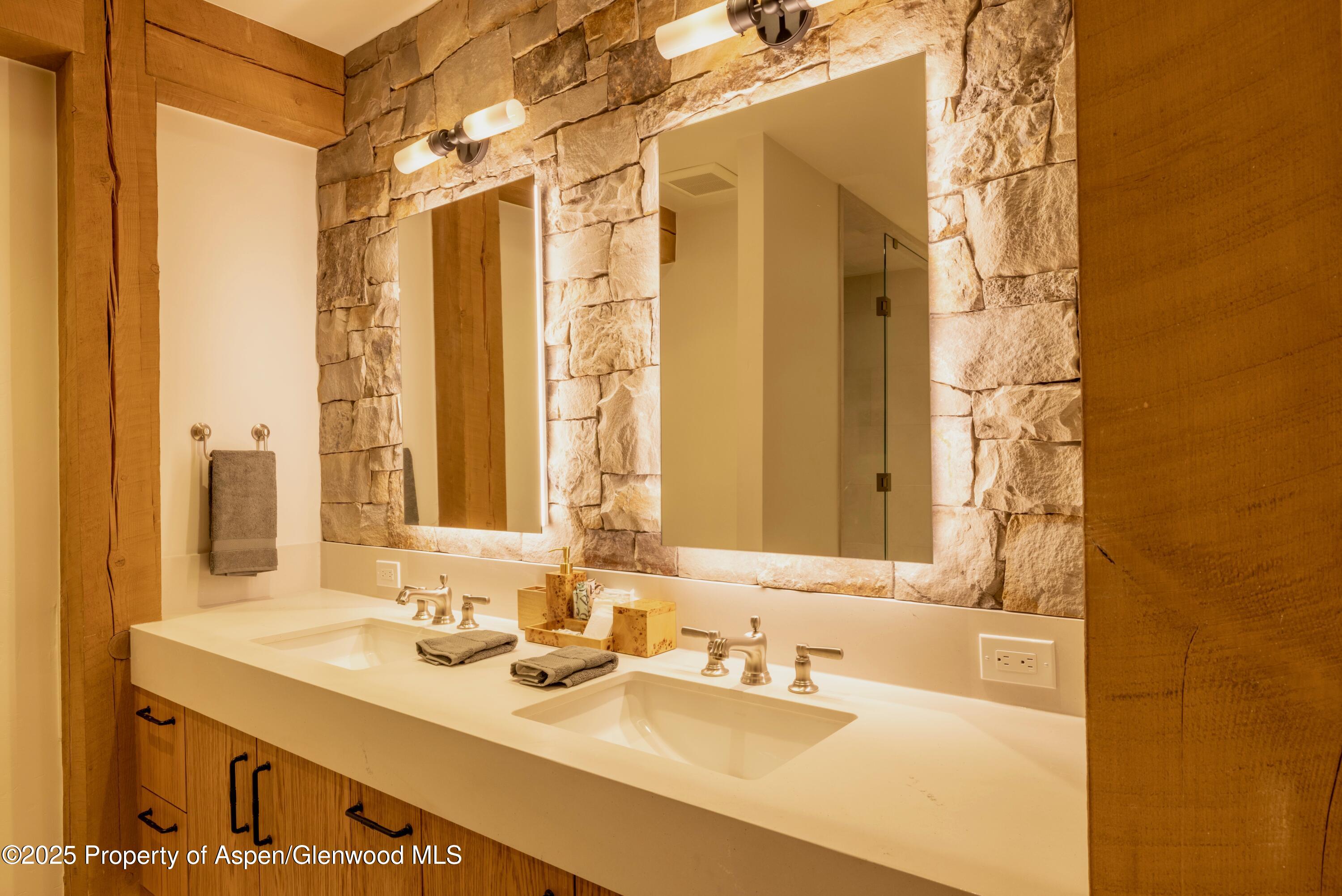4901 Cimarron Mountain Road Montrose, CO 81403 - Photo 33 of 39 a bathroom with a sink and a mirror