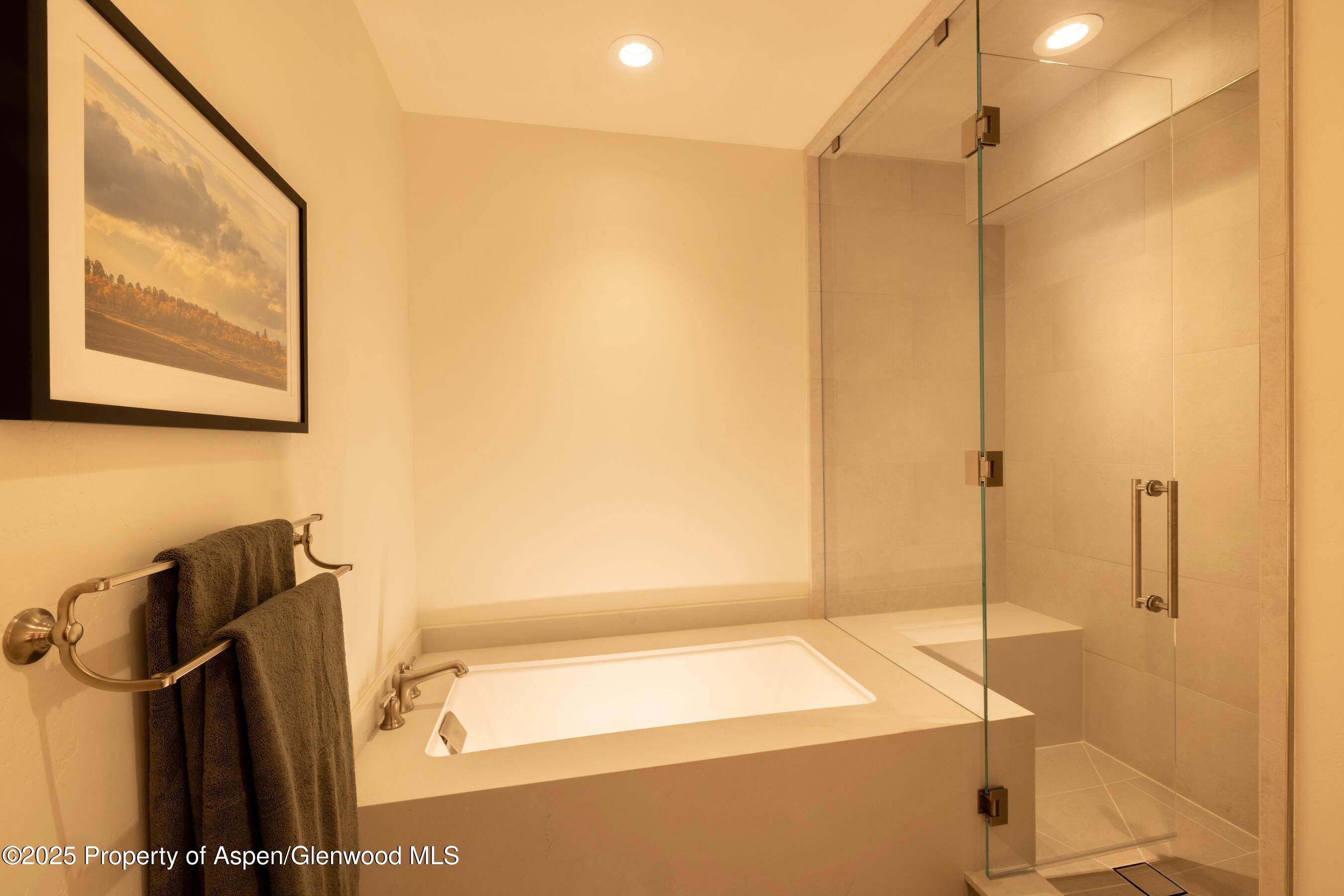 4901 Cimarron Mountain Road Montrose, CO 81403 - Photo 34 of 39 a bathroom with a shower and a tub