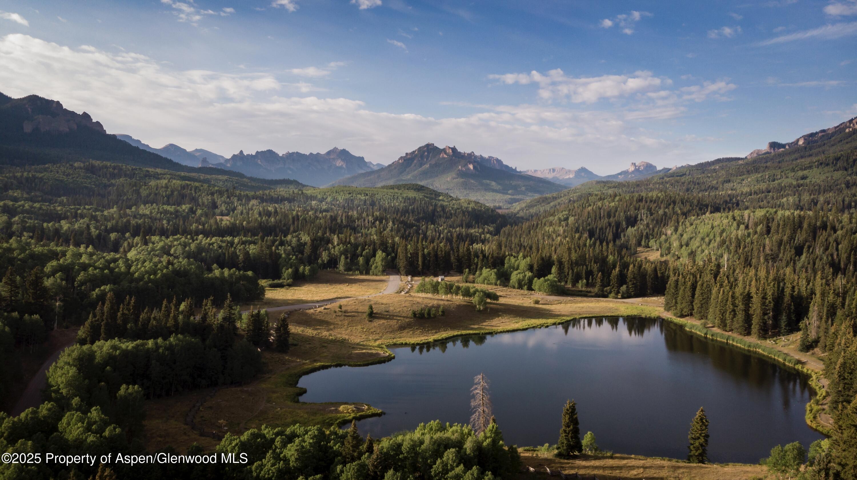 4901 Cimarron Mountain Road Montrose, CO 81403 - Photo 39 of 39 a view of a lake with a mountain