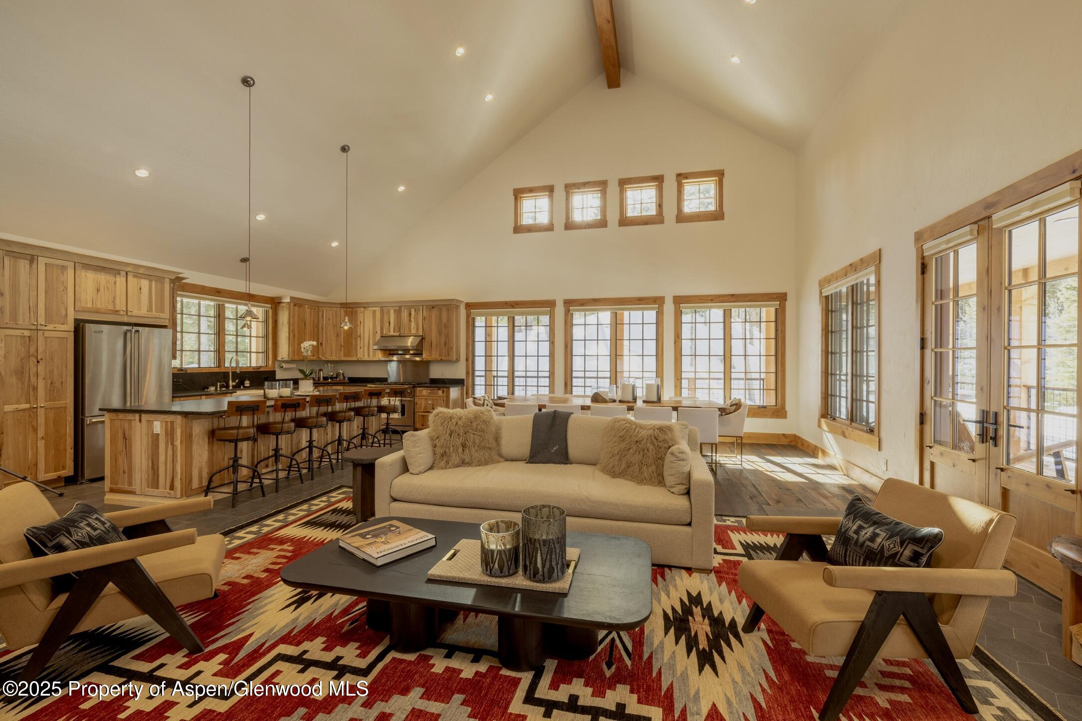 4901 Cimarron Mountain Road Montrose, CO 81403 - Photo 4 of 39 a living room with furniture and a flat screen tv