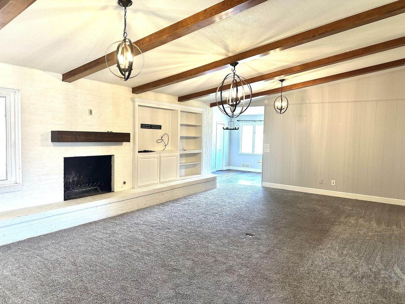819 Holliday Plainview, TX 79072 - Photo 16 of 38 a view of empty room with a fireplace and fan