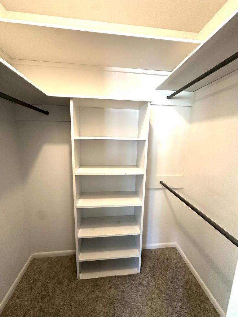 819 Holliday Plainview, TX 79072 - Photo 25 of 38 a view of walk in closet with empty racks