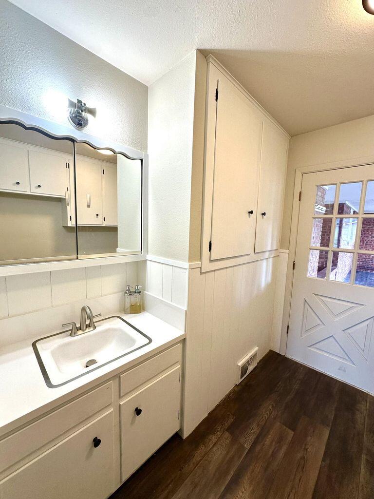 819 Holliday Plainview, TX 79072 - Photo 30 of 38 a bathroom with a sink and a mirror