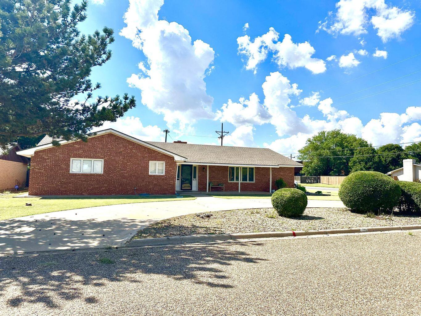 819 Holliday Plainview, TX 79072 - Photo 3 of 38 a front view of a house with a yard
