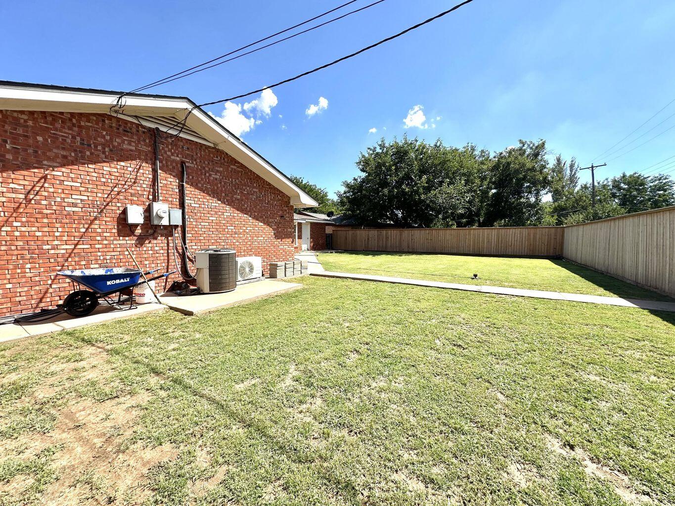 819 Holliday Plainview, TX 79072 - Photo 36 of 38 a view of a swimming pool with an outdoor space and seating area