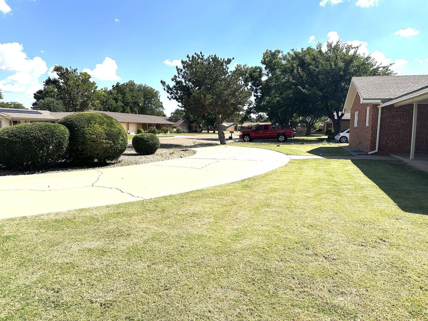 819 Holliday Plainview, TX 79072 - Photo 4 of 38 a view of swimming pool with trees