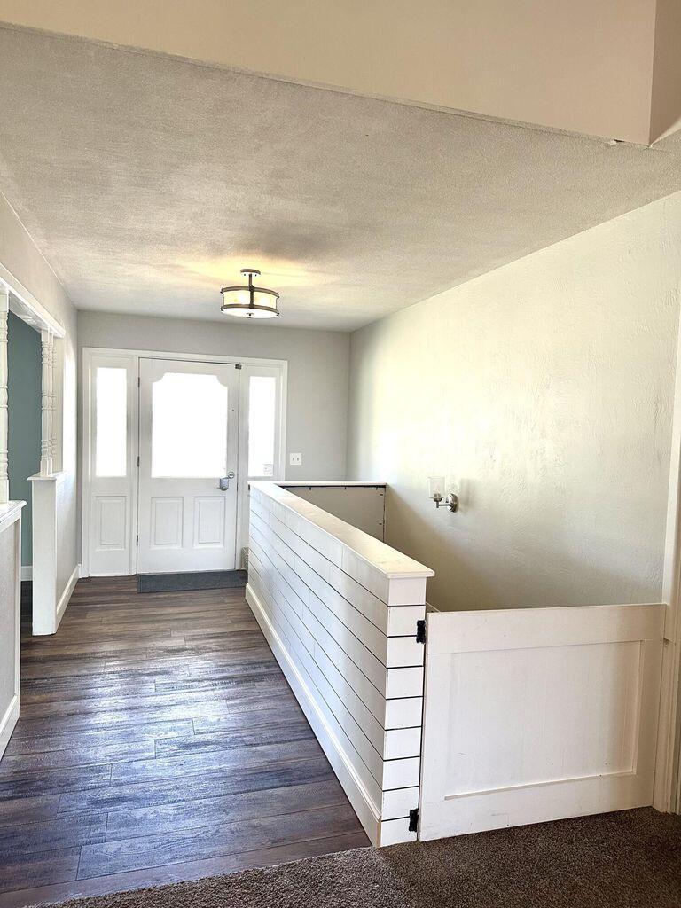 819 Holliday Plainview, TX 79072 - Photo 6 of 38 a view of a room with wooden floor and chair