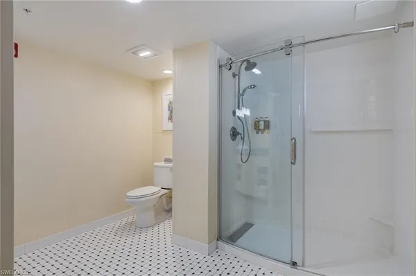 a bathroom with a shower and a toilet