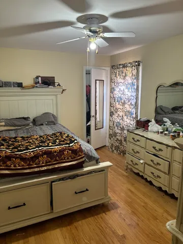 a bedroom with stove and cabinets