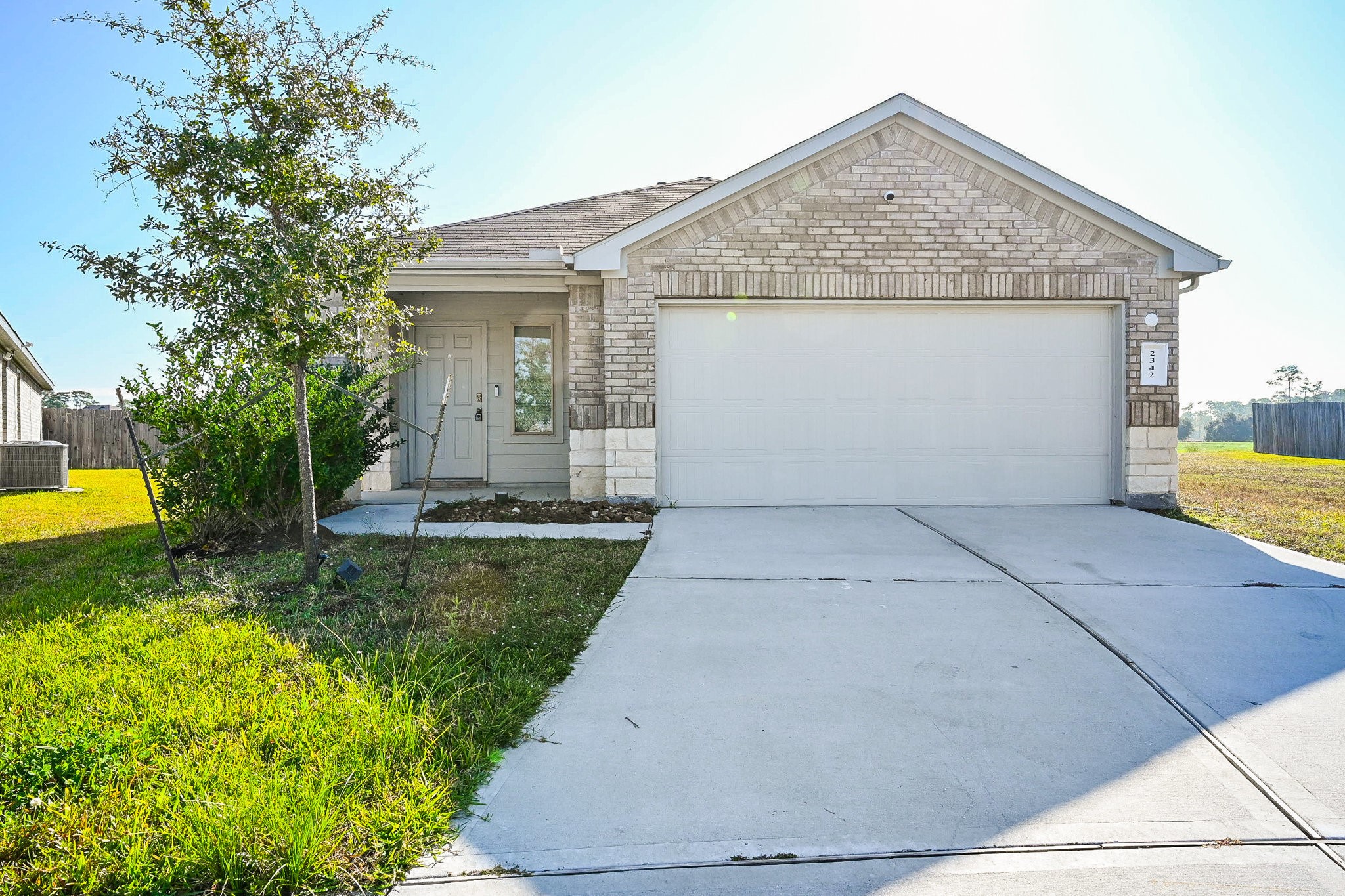2342 Spruce Clf Lane Spring, TX 77373 - Photo 1 of 32 a view of a house with a yard plants and large tree