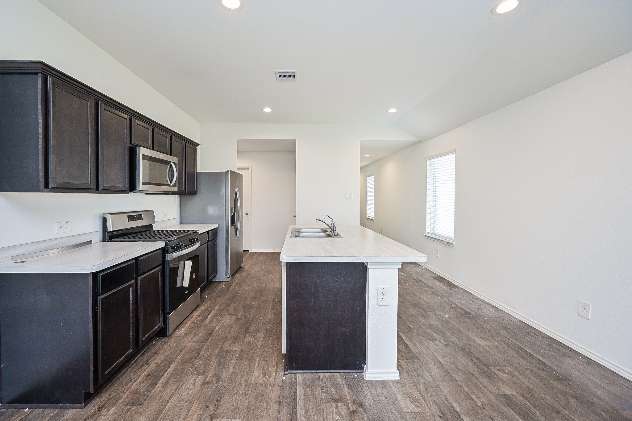 2342 Spruce Clf Lane Spring, TX 77373 - Photo 14 of 32 a kitchen with stainless steel appliances a sink cabinets and wooden floor
