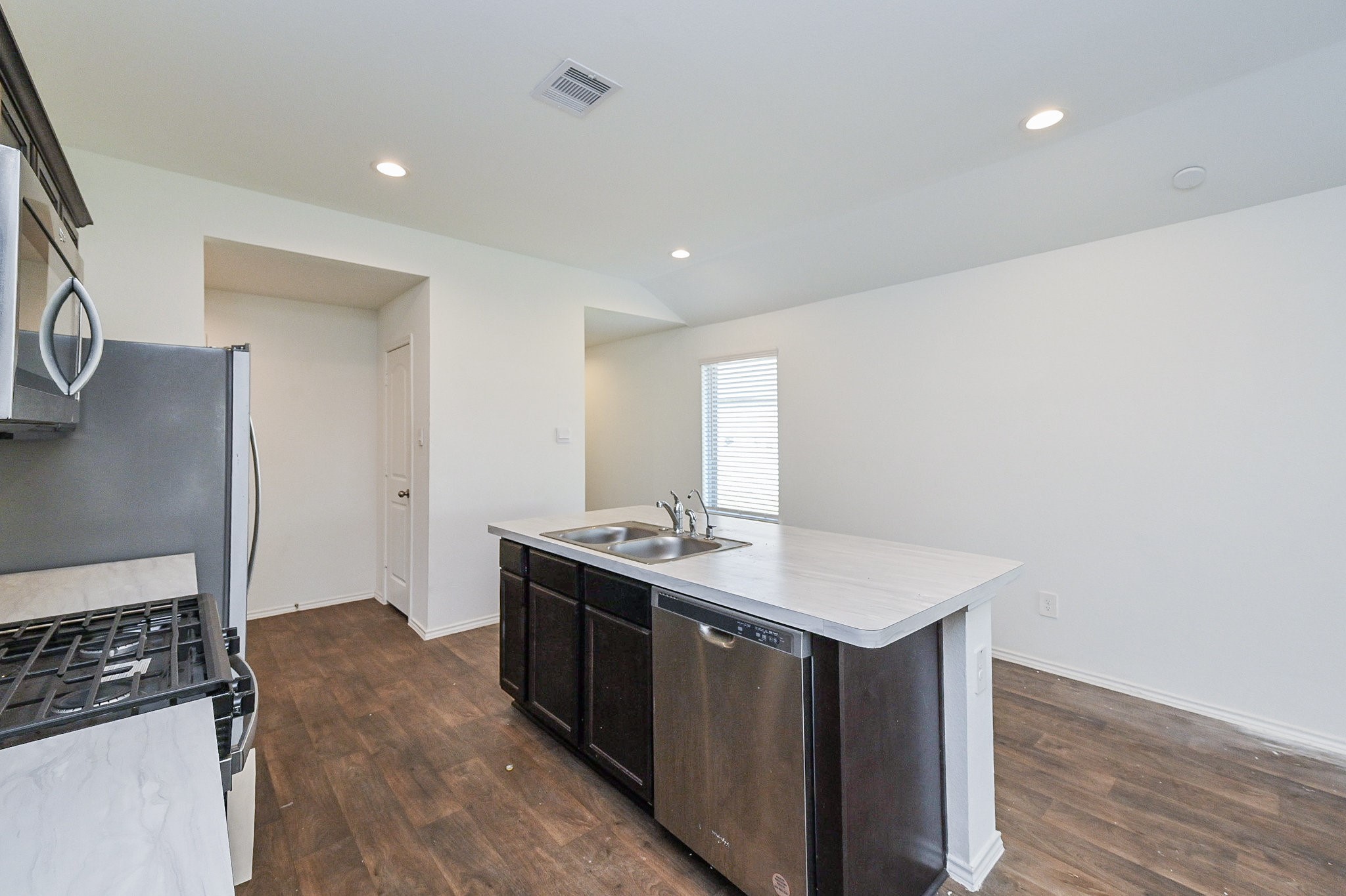 2342 Spruce Clf Lane Spring, TX 77373 - Photo 15 of 32 a kitchen with stainless steel appliances granite countertop a sink stove and refrigerator