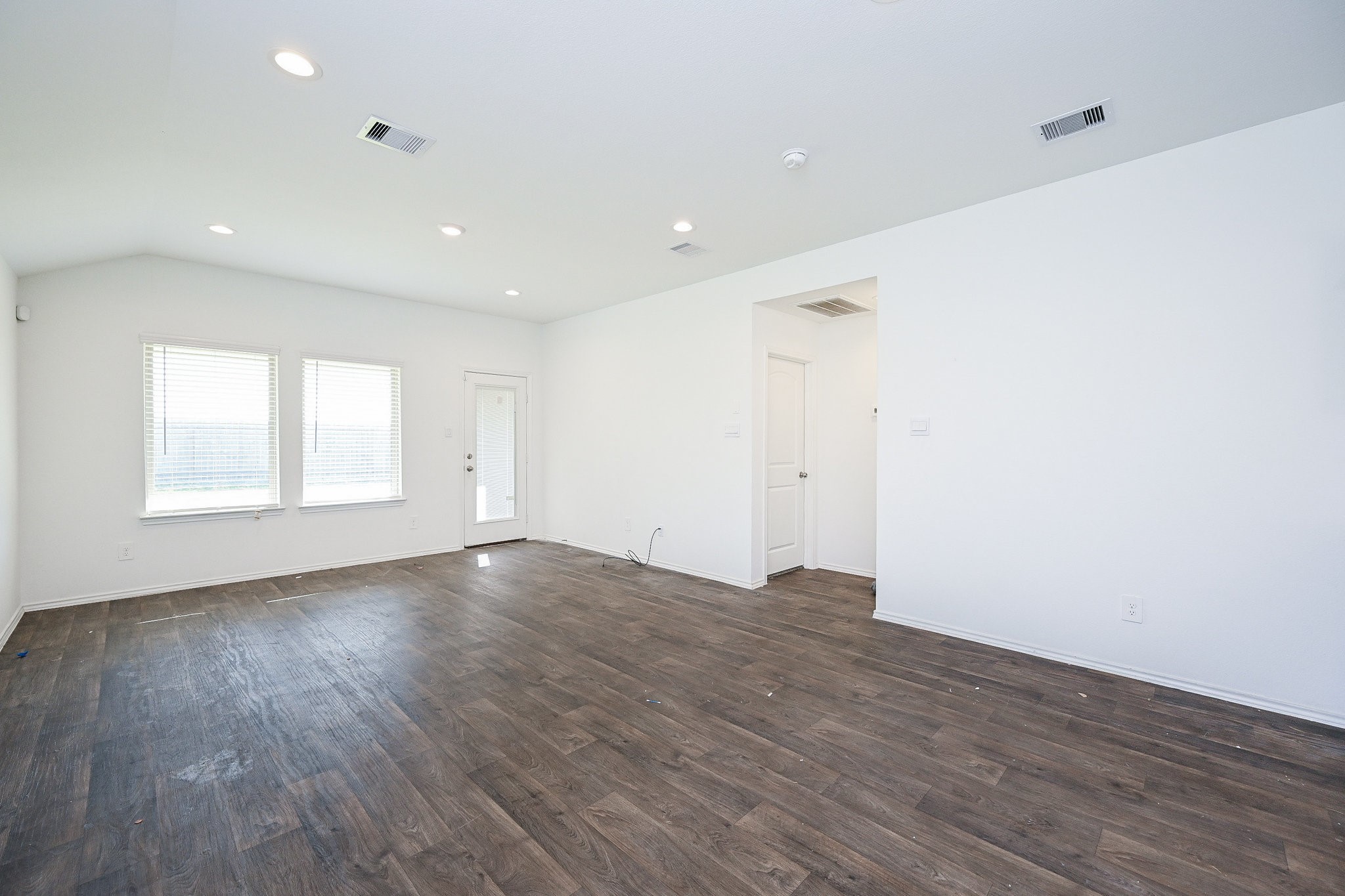 2342 Spruce Clf Lane Spring, TX 77373 - Photo 21 of 32 an empty room with wooden floor and windows