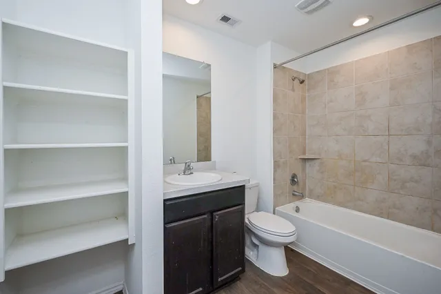 a bathroom with a toilet a sink and a bathtub