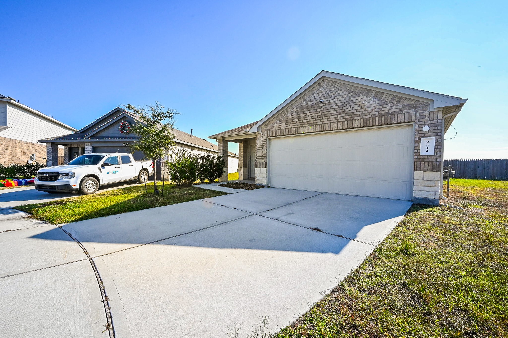 2342 Spruce Clf Lane Spring, TX 77373 - Photo 3 of 32 a front view of a house with a yard and garage