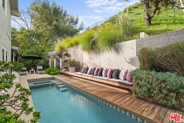 a view of swimming pool with chairs