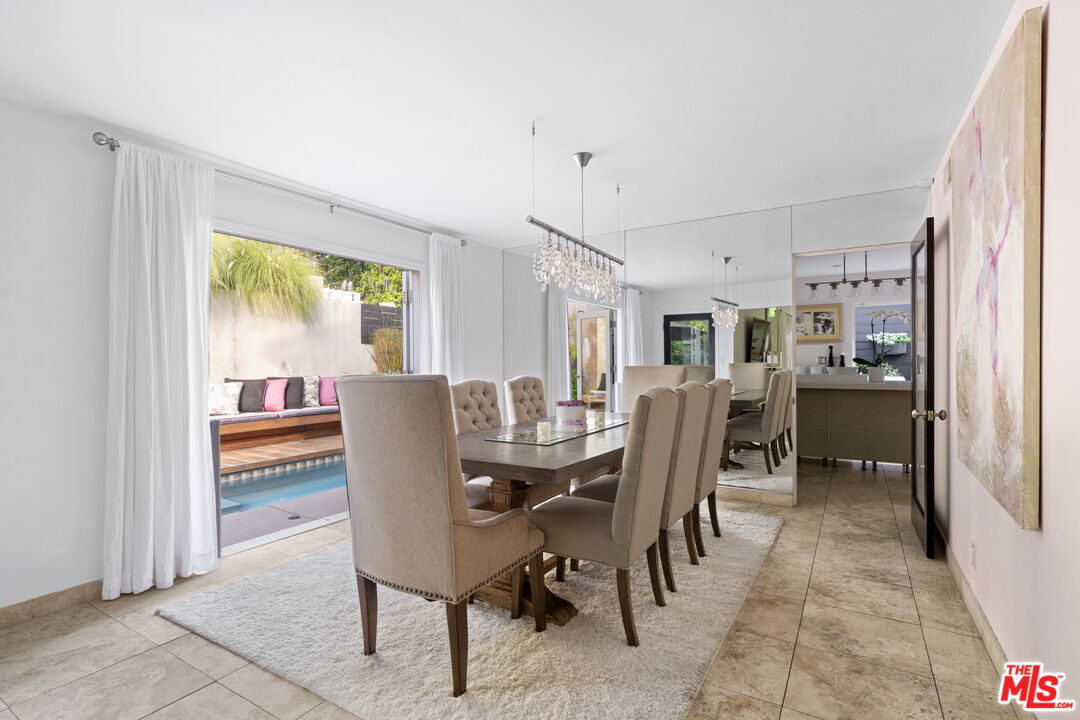 9767 Apricot Lane Beverly Hills, CA 90210 - Photo 11 of 29 a view of a dining room with furniture window and outside view