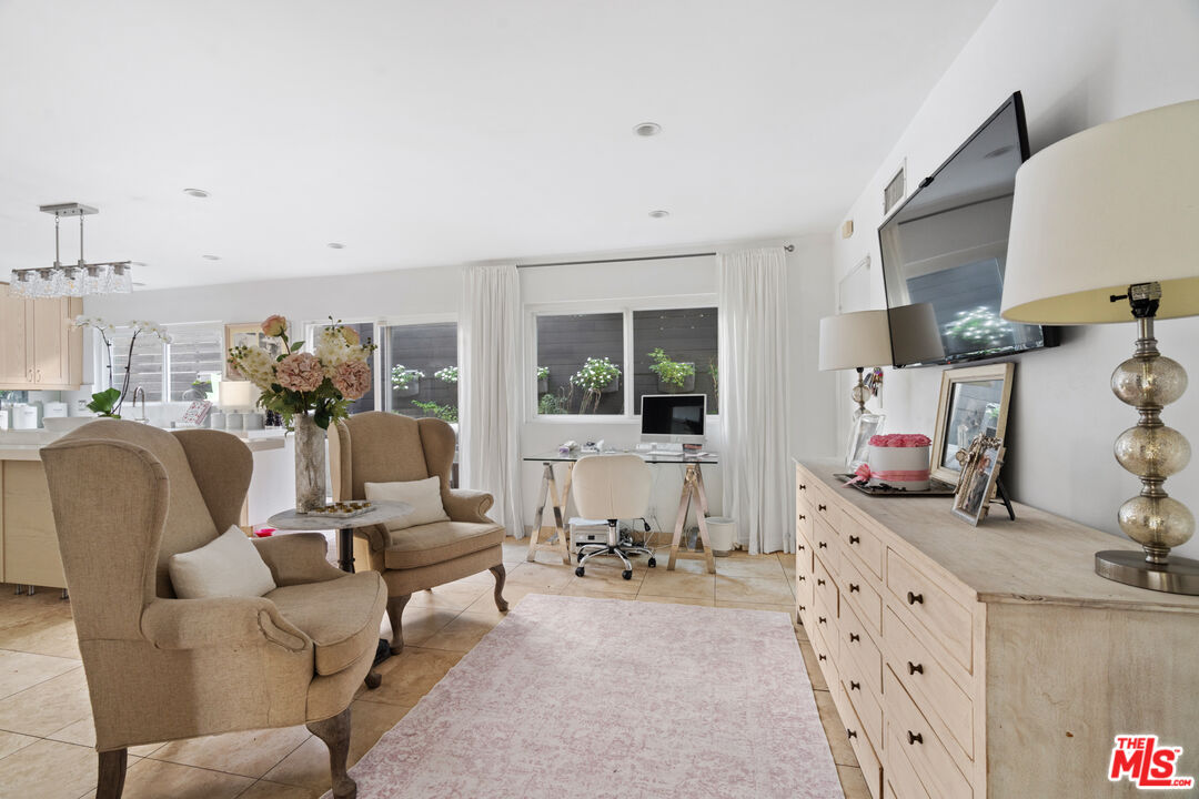 9767 Apricot Lane Beverly Hills, CA 90210 - Photo 13 of 29 a living room with furniture and a flat screen tv
